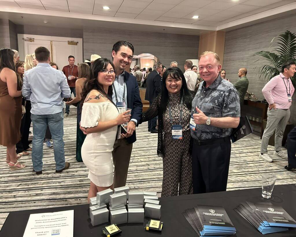 Robby Turner and Athena Vargus at a RealWealth real estate investing event.