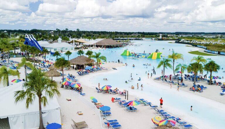 Photo of lagoon at the Mirada project. Beach loungers and people swimming