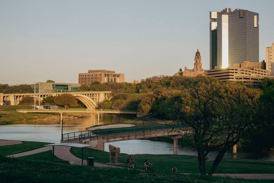 pexels-photo-11863074-11863074 Tranquil Fort Worth skyline with bridges over Trinity River at sunset, Texas.