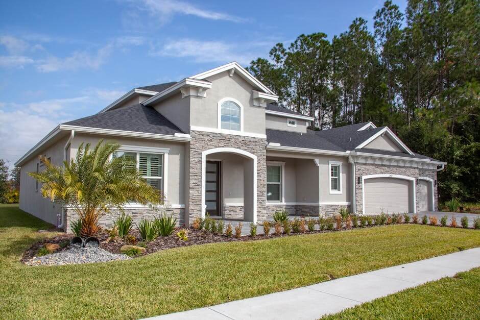 Beautiful modern suburban house in Odessa, FL with lush garden and clear blue sky.