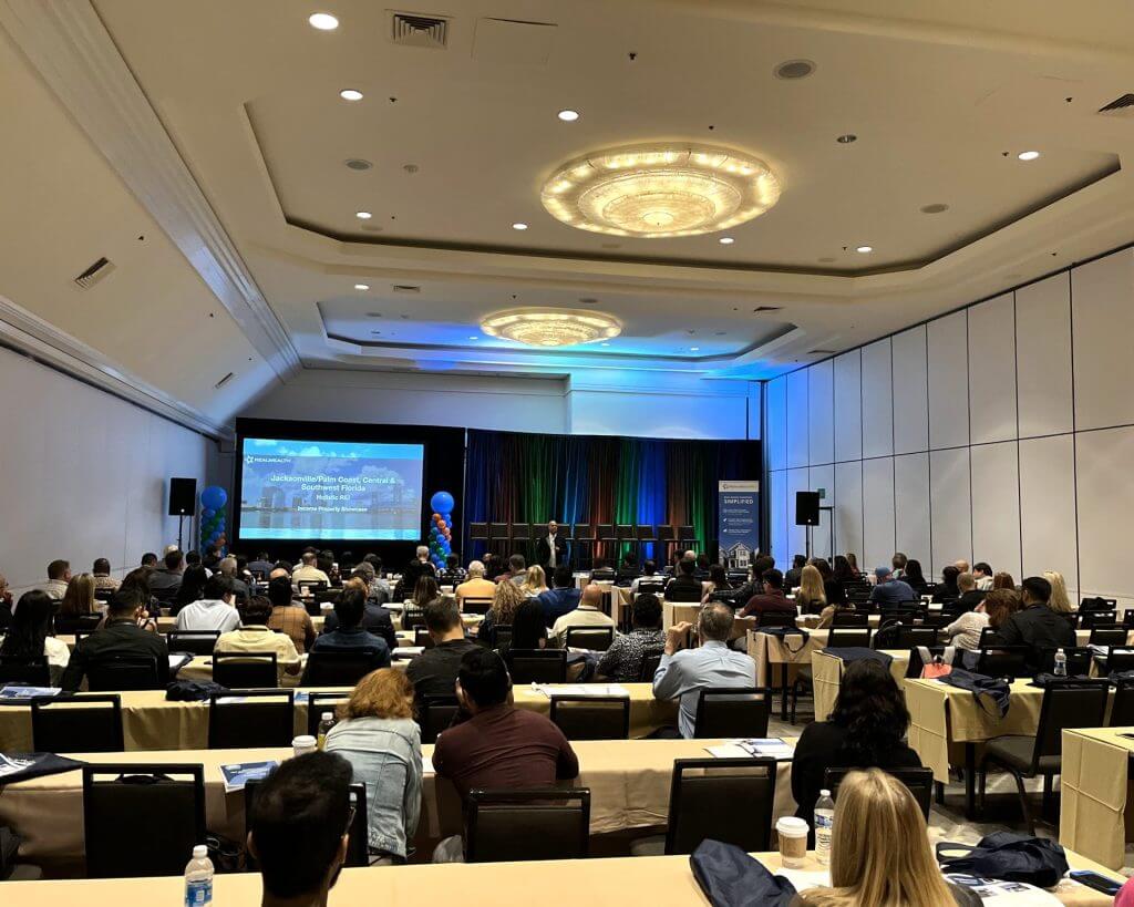 Investors at RealWealth's real estate investing live event.